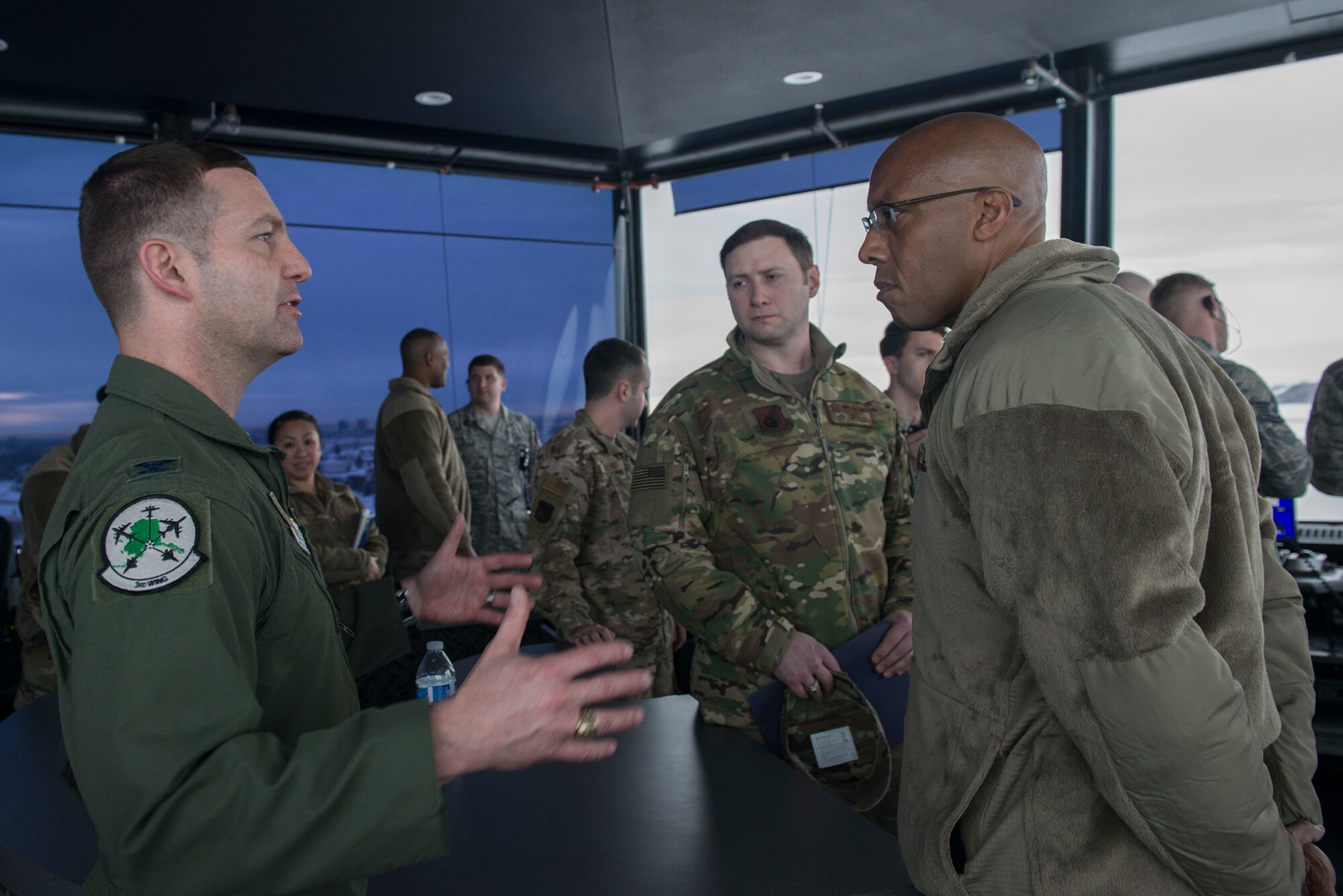 U.S. Air Force Col. Robert Davis, 3rd Wing commander, discusses Joint Base Elmendorf-Richardson’s (JBER) mission capabilities with Gen. CQ Brown, Jr., Pacific Air Forces (PACAF) commander, during a tour of facilities at JBER, Alaska, Feb. 11, 2019. Brown visited JBER to meet with Airmen and to emphasize operational readiness. PACAF leadership toured various facilities throughout the installation to include the air traffic control tower, 517th Airlift Squadron and 962nd Airborne Air Control Squadron.