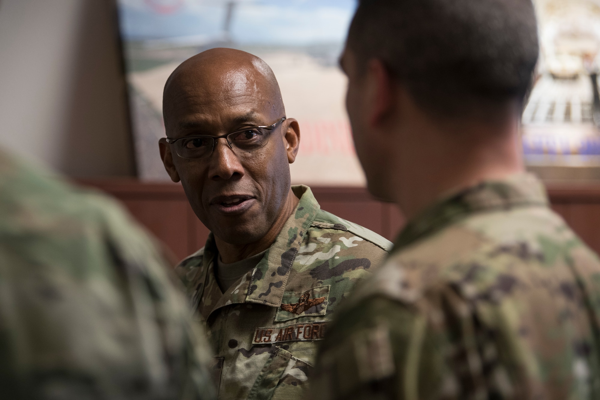 U.S. Air Force Gen. CQ Brown, Jr., Pacific Air Forces (PACAF) commander, discusses PACAF mission readiness with an Airman from the 517th Airlift Squadron (AS) during a tour at Joint Base Elmendorf-Richardson (JBER), Alaska, Feb. 11, 2019. Brown visited JBER to meet with Airmen and to emphasize operational readiness. PACAF leadership toured various facilities throughout the installation to include the air traffic control tower, 517th AS and 962nd Airborne Air Control Squadron.