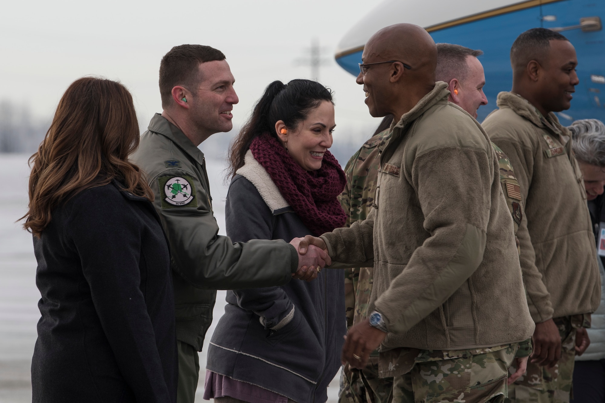 U.S. Air Force Gen. CQ Brown, Jr., Pacific Air Forces (PACAF) commander, shakes hands with Col. Robert Davis, 3rd Wing commander, following his arrival at Joint Base Elmendorf-Richardson (JBER), Alaska, Feb. 11, 2019. Brown visited JBER to meet with Airmen and to emphasize operational readiness. PACAF leadership toured various facilities throughout the installation to include the air traffic control tower, 517th Airlift Squadron and 962nd Airborne Air Control Squadron.