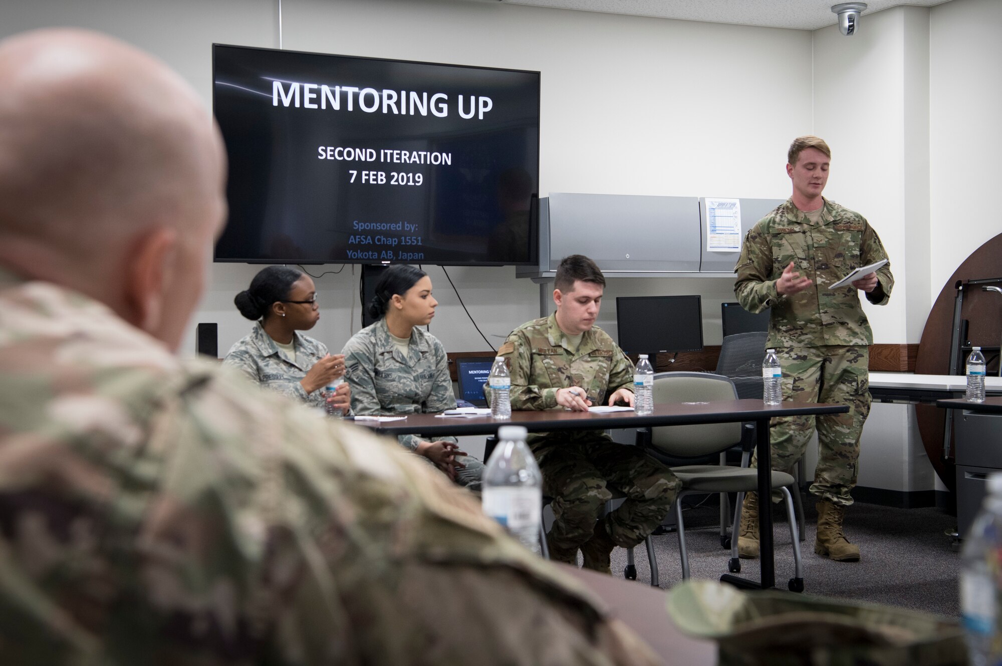 Senior Airman Joshua R. Swenk, 374th Logistics and Readiness Squadron ground transportation operator, speaks to senior enlisted leaders about curfew and dorm policies during the second annual Mentoring Up event, Feb. 7, 2018, at Yokota Air Base, Japan. Mentoring Up is a forum between Team Yokota’s Chief’s Group and Airmen to discuss issues and topics relative to the base with the goal to initiate new or improve upon existing programs in hopes that communication, morale, and retention efforts are more effective. (U.S. Air Force photo by Senior Airman Donald Hudson)