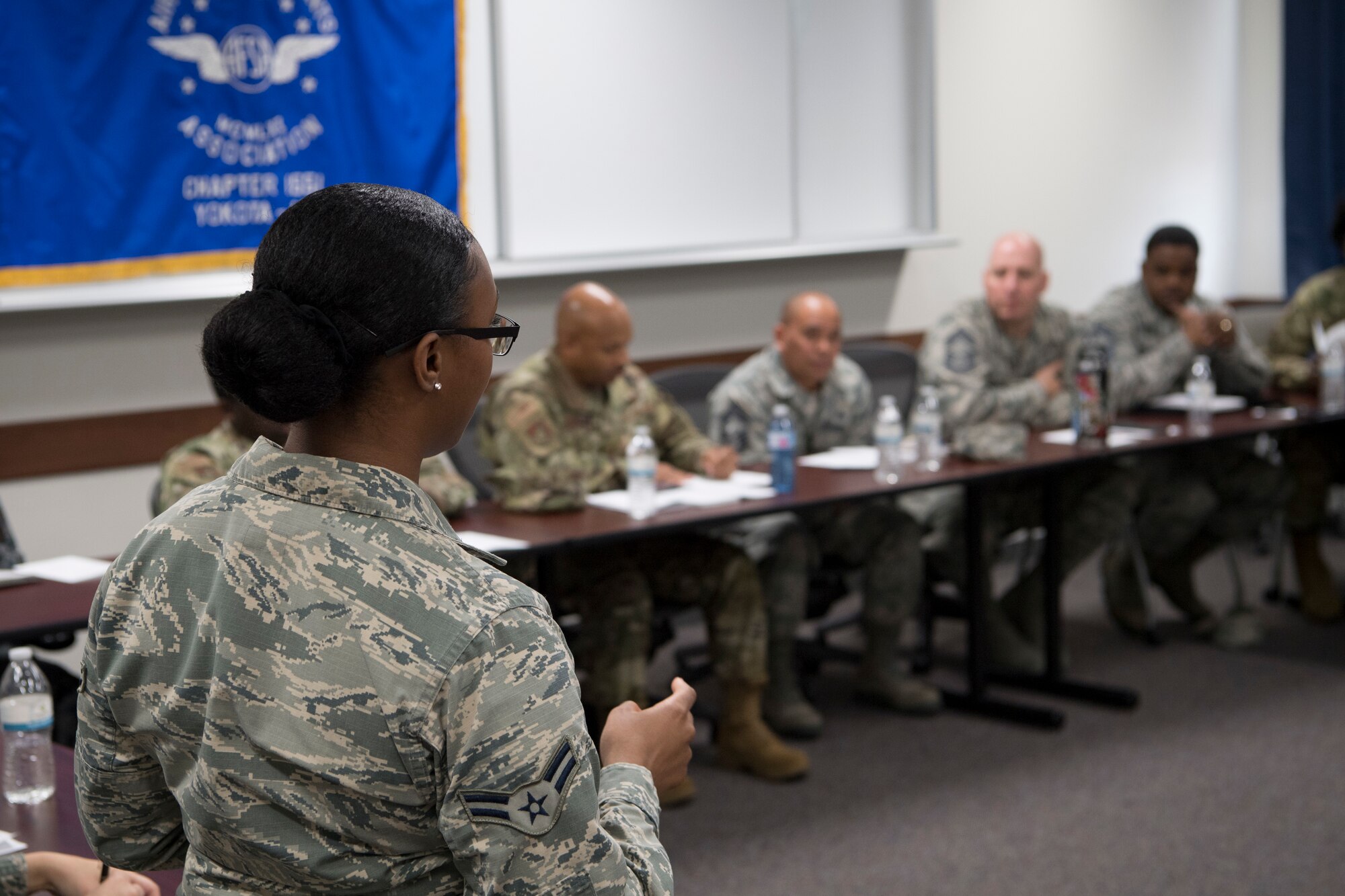 Airman 1st Class Jayla T. Pressley, 374th Aerospace Medical Squadron public health technician, speaks to senior enlisted leaders about dining facility meal cards and the Yokota App during the second annual Mentoring Up event Feb. 7, 2018, at Yokota Air Base, Japan. The annual Mentoring Up event, sponsored by the Air Force Sergeants Association, is currently only offered at Yokota Air Base and has been such a success that Yokota’s senior enlisted leaders are looking to hold the event more often. (U.S. Air Force photo by Senior Airman Donald Hudson)