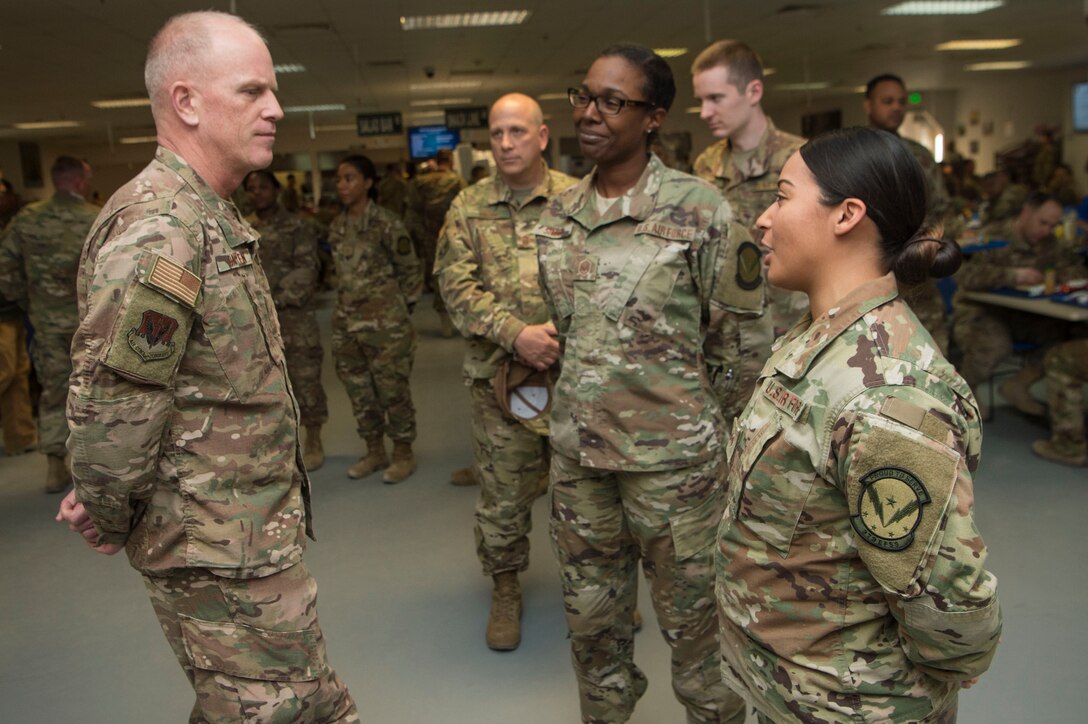 Chief Master Sgt. Frank Batten, Air Combat Command command chief, interacts with Airmen during lunch at the Manhattan Dining Facility Feb. 11, 2019, at Al Udeid Air Base, Qatar.