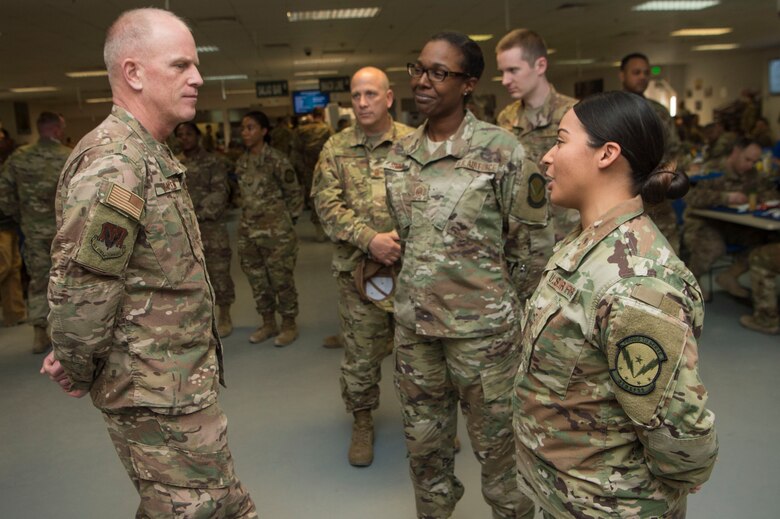 Chief Master Sgt. Frank Batten, Air Combat Command command chief, interacts with Airmen during lunch at the Manhattan Dining Facility Feb. 11, 2019, at Al Udeid Air Base, Qatar.