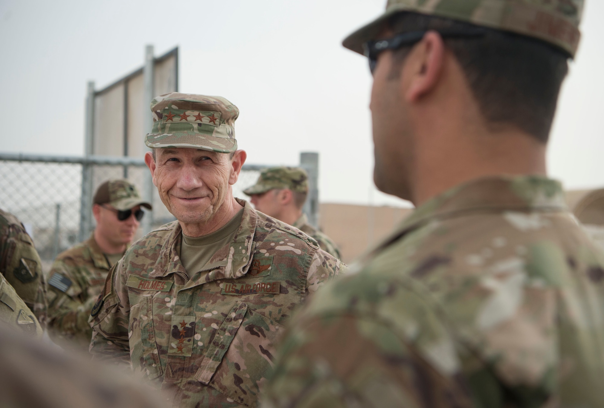 Gen. Mike Holmes, commander of Air Combat Command , listens to force protection Airmen deployed to the 379th Expeditionary Civil Engineer Squadron during an ACC leadership visit Feb. 11, 2019, at Al Udeid Air Base, Qatar.