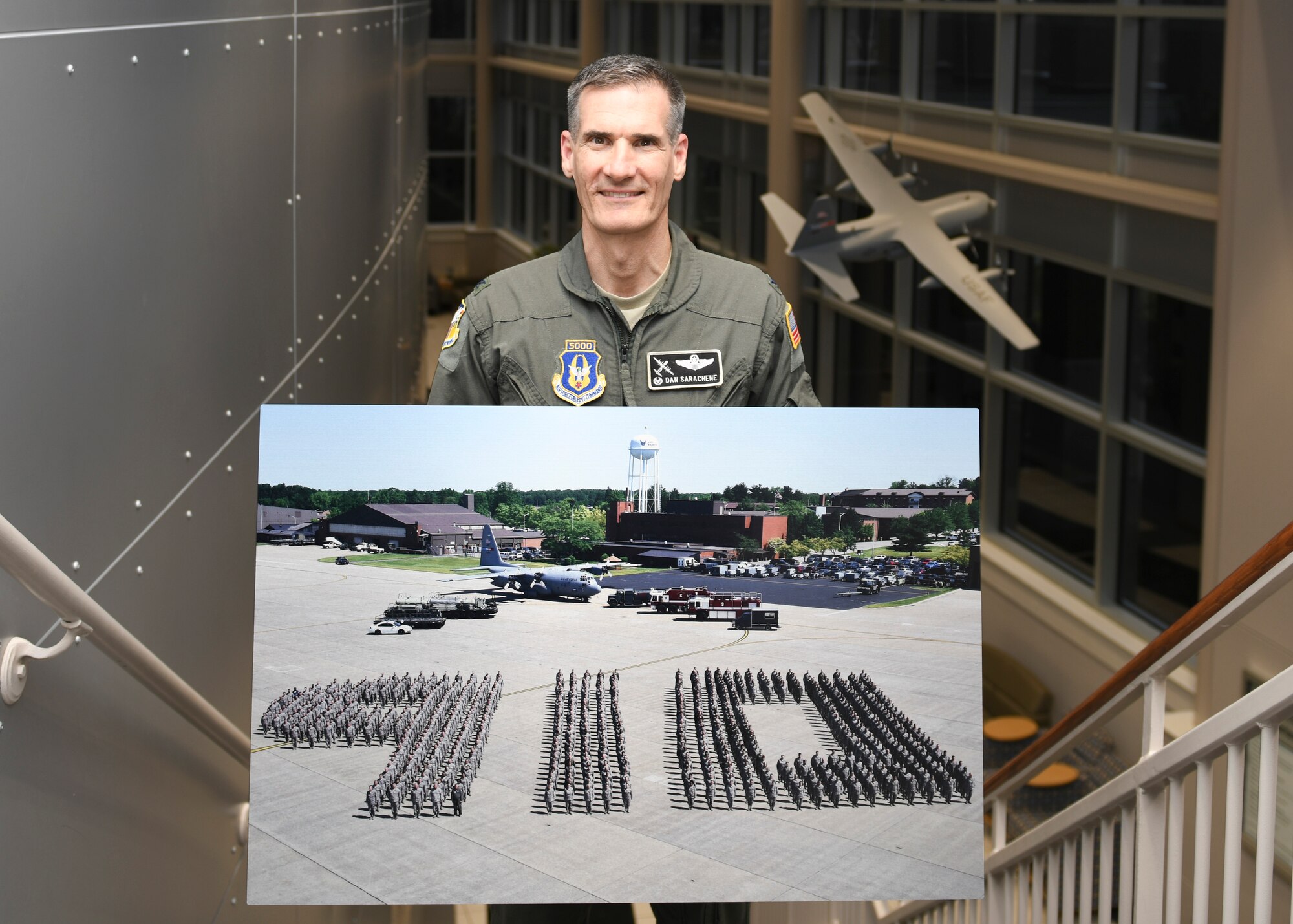 Col. Dan Sarachene, former 910th Airlift Wing commander, takes a selfie in front of a formation of 910th Reserve Citizen Airmen at a change of command ceremony where he relinquished command at Youngstown Air Reserve Station, Feb. 9, 2019.