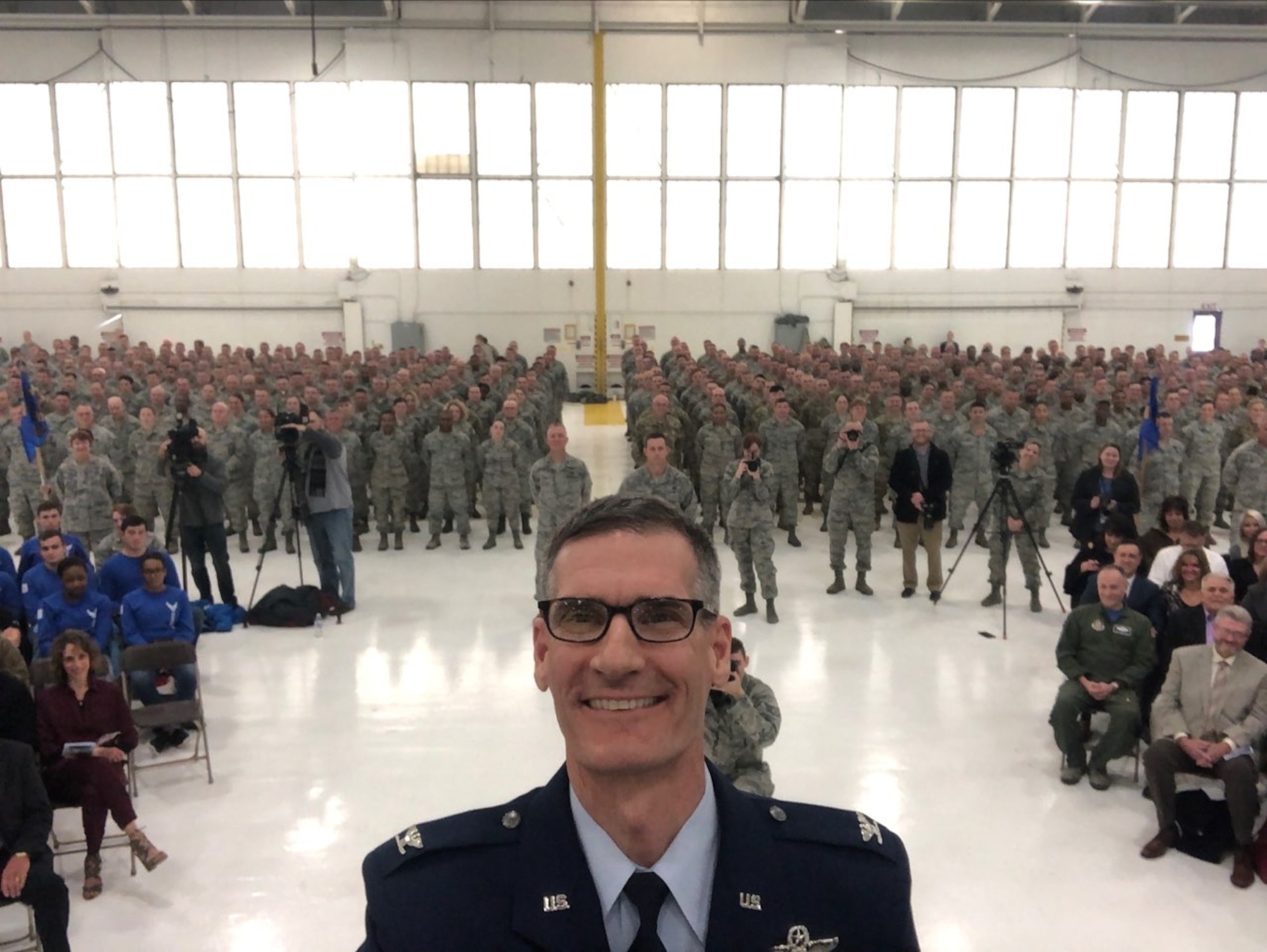 Col. Dan Sarachene, former 910th Airlift Wing commander, takes a selfie in front of a formation of 910th Reserve Citizen Airmen at a change of command ceremony where he relinquished command at Youngstown Air Reserve Station, Feb. 9, 2019.