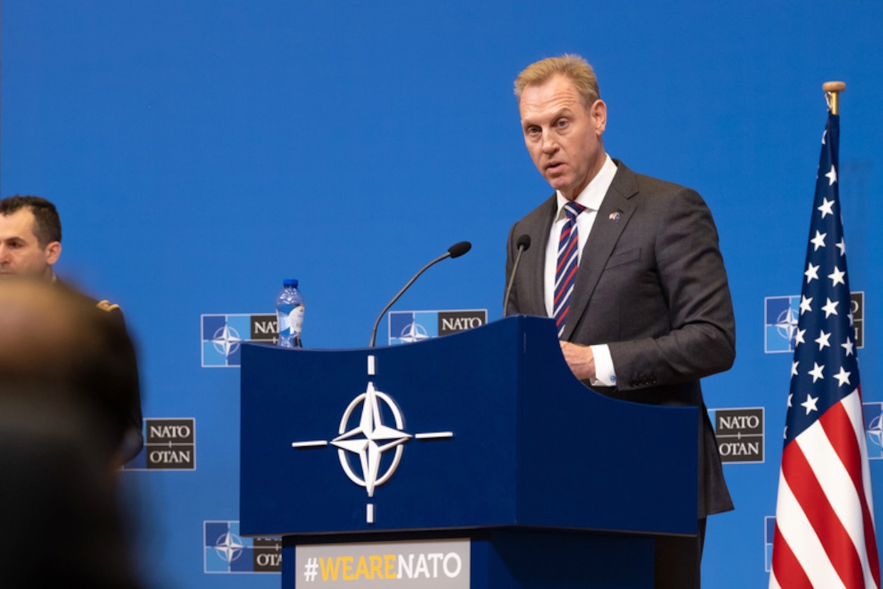 Acting Defense Secretary Patrick M. Shanahan speaks at a lectern.