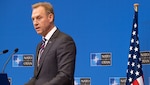 Acting Defense Secretary Patrick M. Shanahan answers questions during a news conference at the conclusion of the NATO defense ministerial conference in Brussels.