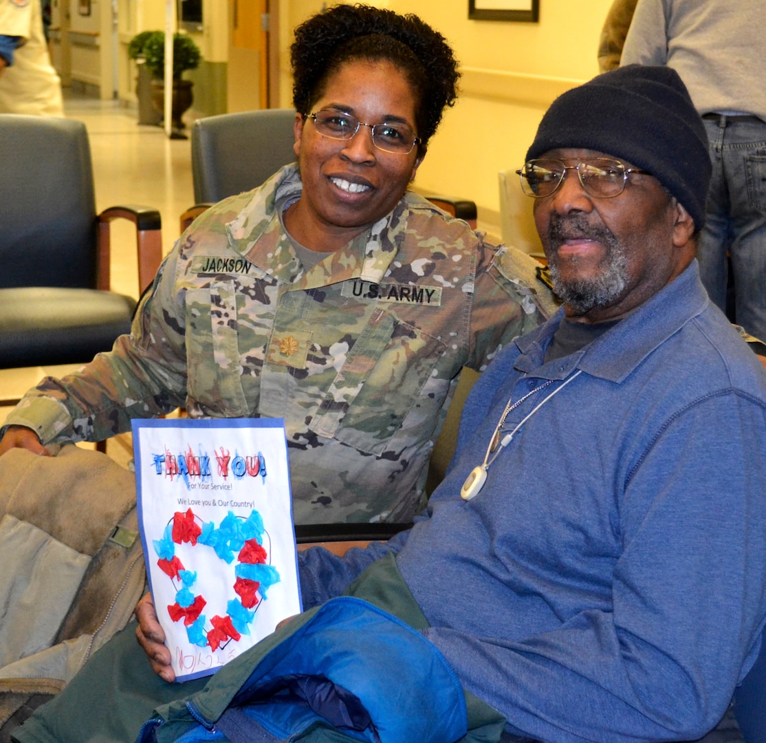 Army Maj. Andrea Jackson, a Medical division chief, left, poses with a patient waiting for care at the Corporal Michael J. Crescenz Veterans Affairs Medical Center, Feb. 11, 2019 in Philadelphia.