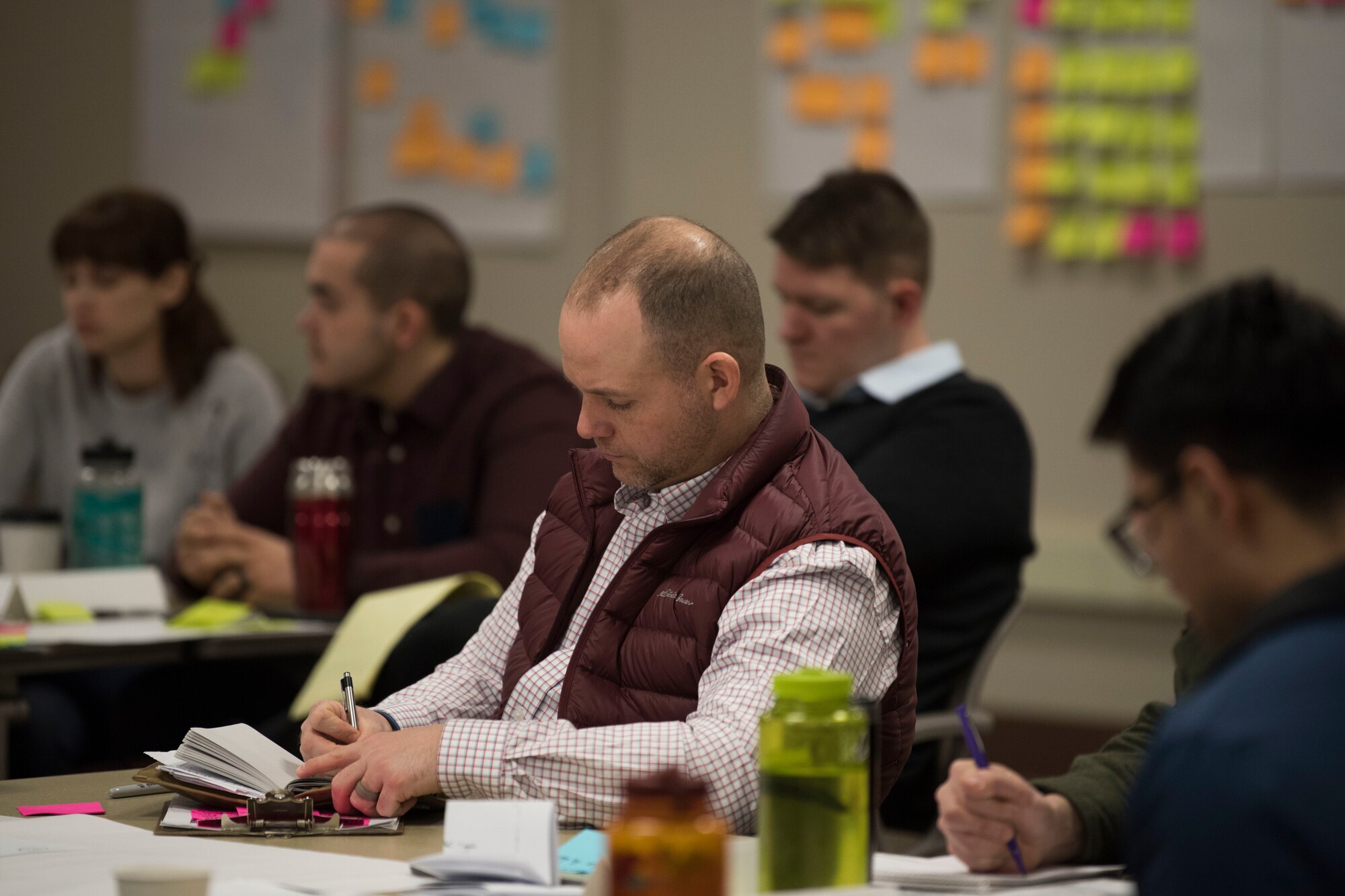 Participants work together using methods and processes learned during an MD5 Boot Camp at Joint Base Elmendorf-Richardson, Alaska, Feb. 6, 2019. The intensive workshop hosted by the 673d Air Base Wing gave 40 innovators – service members and civilian employees from JBER and Eielson Air Force Base – an opportunity to focus on generating new ideas, nurturing talent and finding new applications of technology.