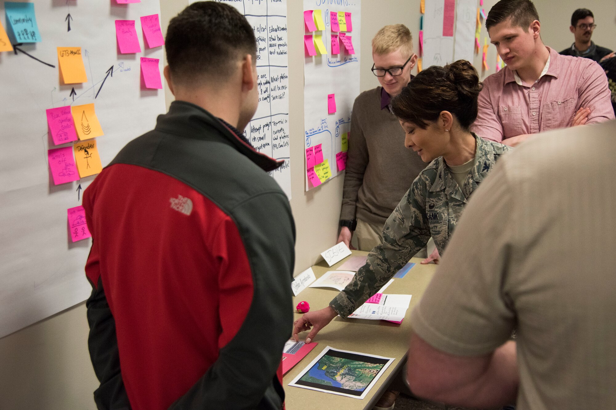 Teams present potential innovative solutions to the 673d Air Base Wing commander and leadership panel during an MD5 Boot Camp at Joint Base Elmendorf-Richardson, Alaska, Feb. 7, 2019. The intensive workshop hosted by the 673d Air Base Wing gave 40 innovators – service members and civilian employees from JBER and Eielson Air Force Base – an opportunity to focus on generating new ideas, nurturing talent and finding new applications of technology. Because of the course’s interactive lecture series and unique design, attendees were able to strategize viable solutions addressing one of the commander’s top priorities in less than four days.