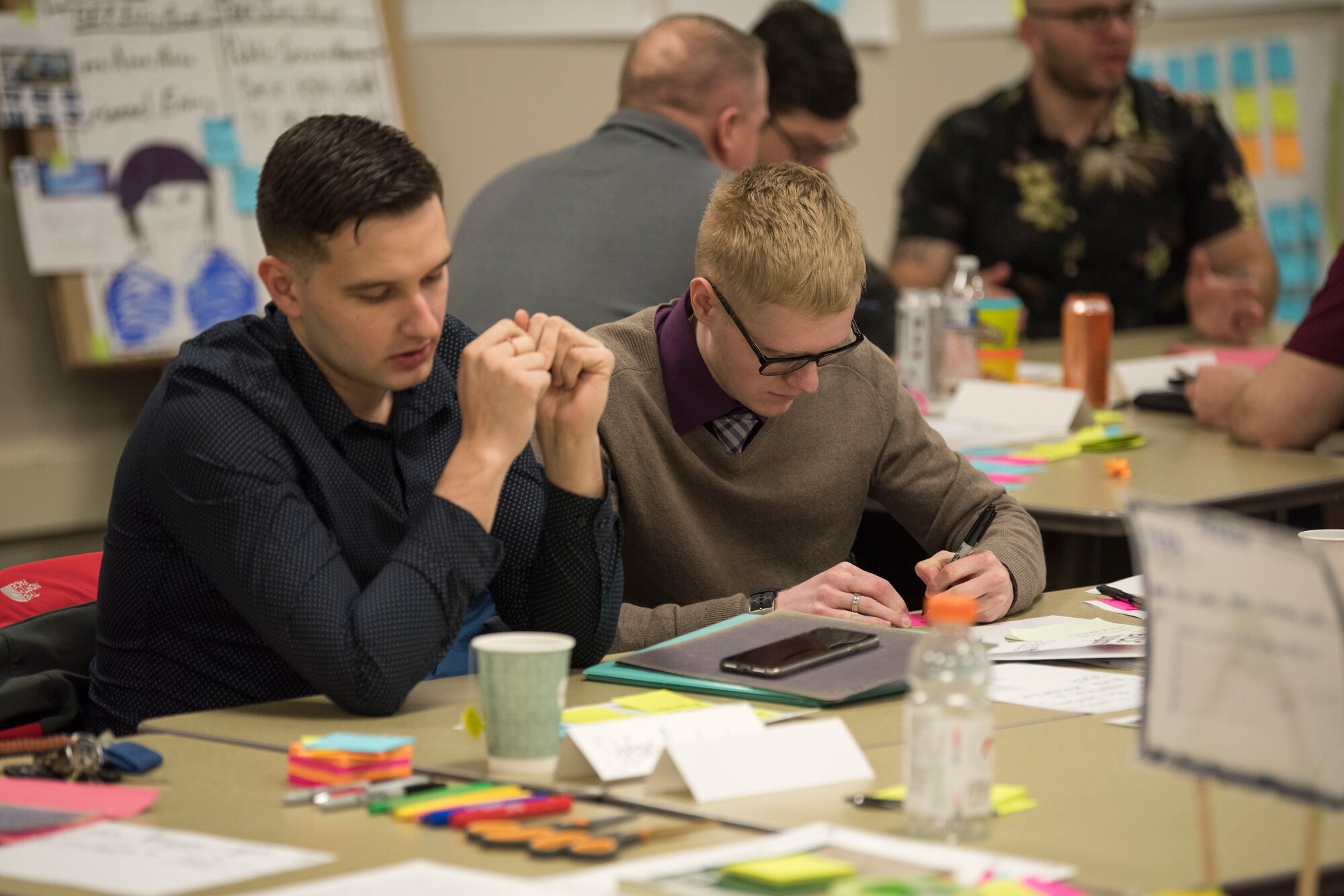 Participants work together using methods and processes learned during an MD5 Boot Camp at Joint Base Elmendorf-Richardson, Alaska, Feb. 7, 2019. The intensive workshop hosted by the 673d Air Base Wing gave 40 innovators – service members and civilian employees from JBER and Eielson Air Force Base – an opportunity to focus on generating new ideas, nurturing talent and finding new applications of technology.