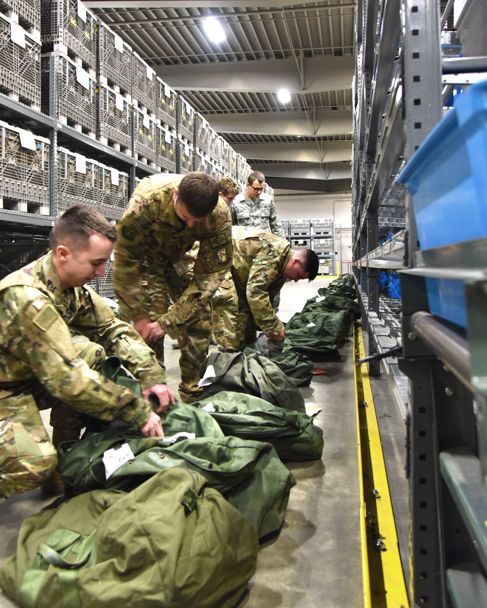 913th Airlift Group Airmen are issued personal protective equipment while processing through the pre-deployment function line Jan. 3, 2019, at Little Rock Air Force Base, Ark.