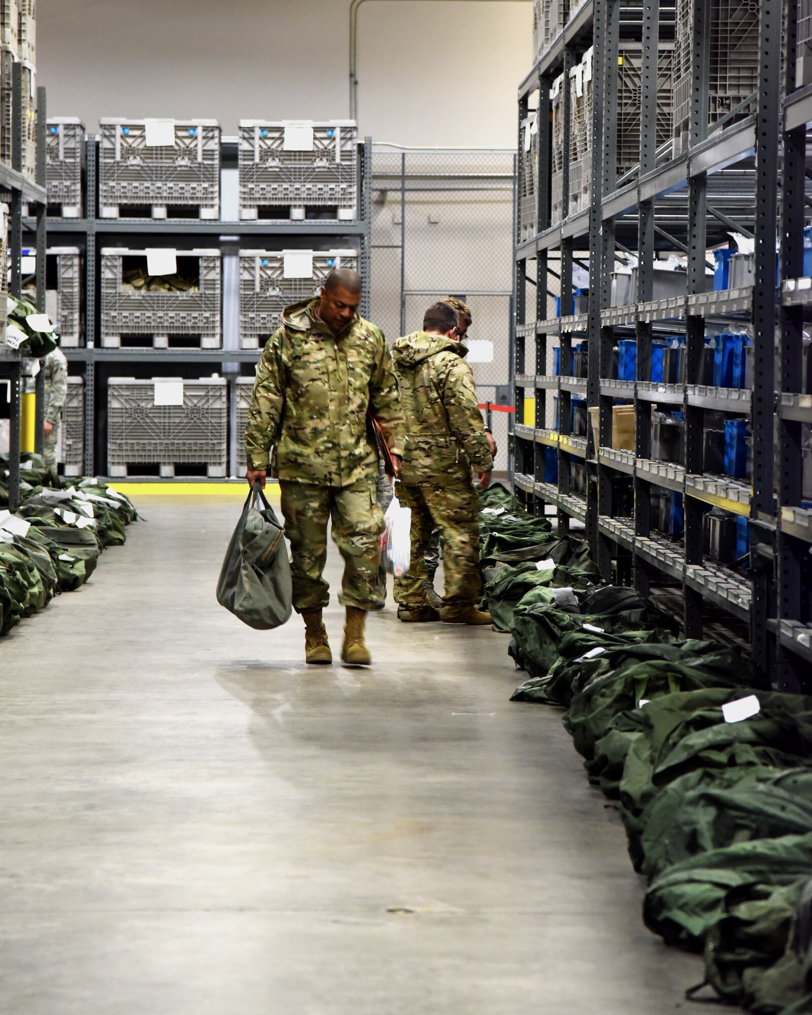 913th Airlift Group Airmen are issued personal protective equipment while processing through the pre-deployment function line Jan. 3, 2019, at Little Rock Air Force Base, Ark.