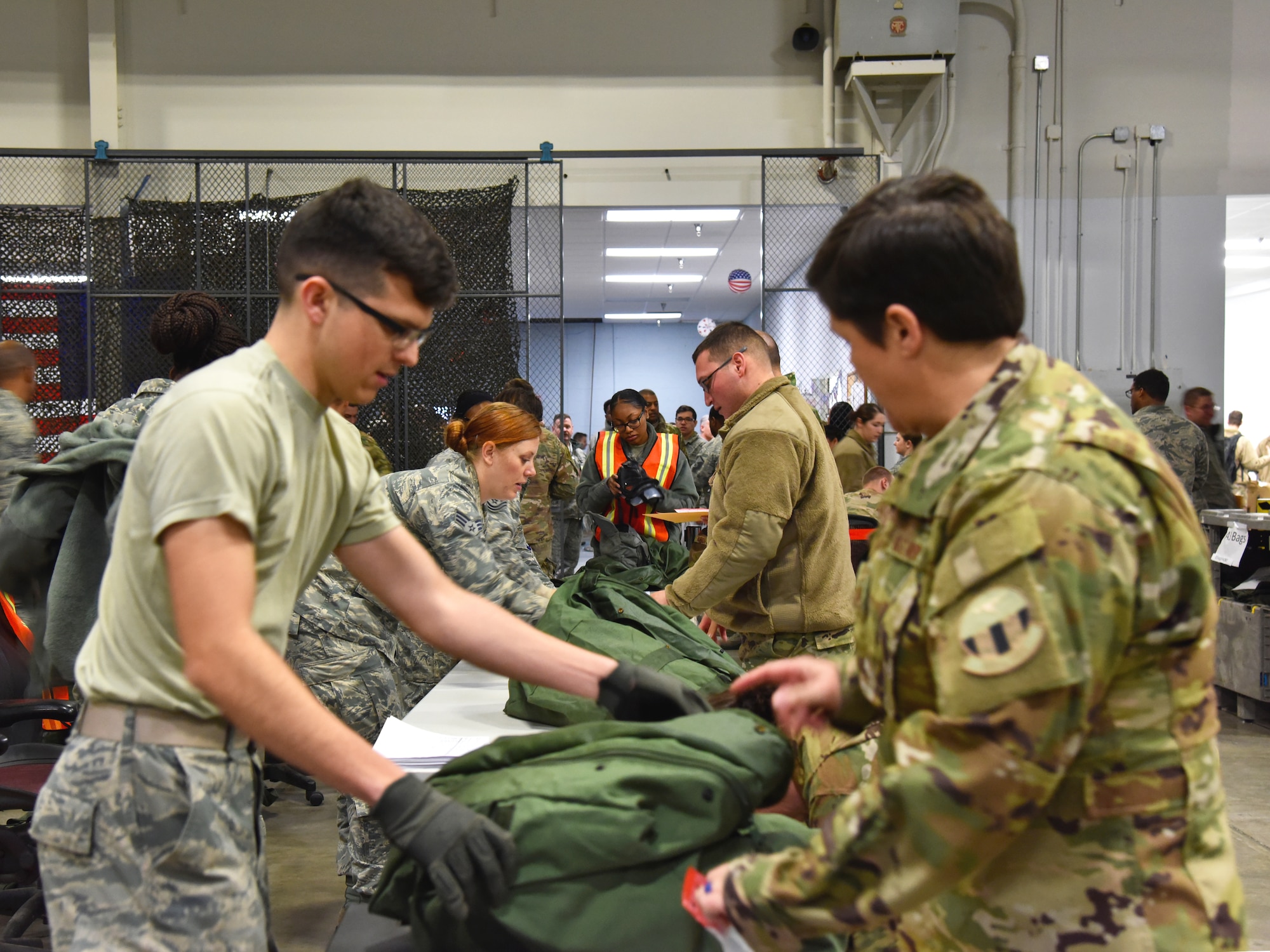 913th Airlift Group Airmen are issued personal protective equipment while processing through the pre-deployment function line Jan. 3, 2019, at Little Rock Air Force Base, Ark.