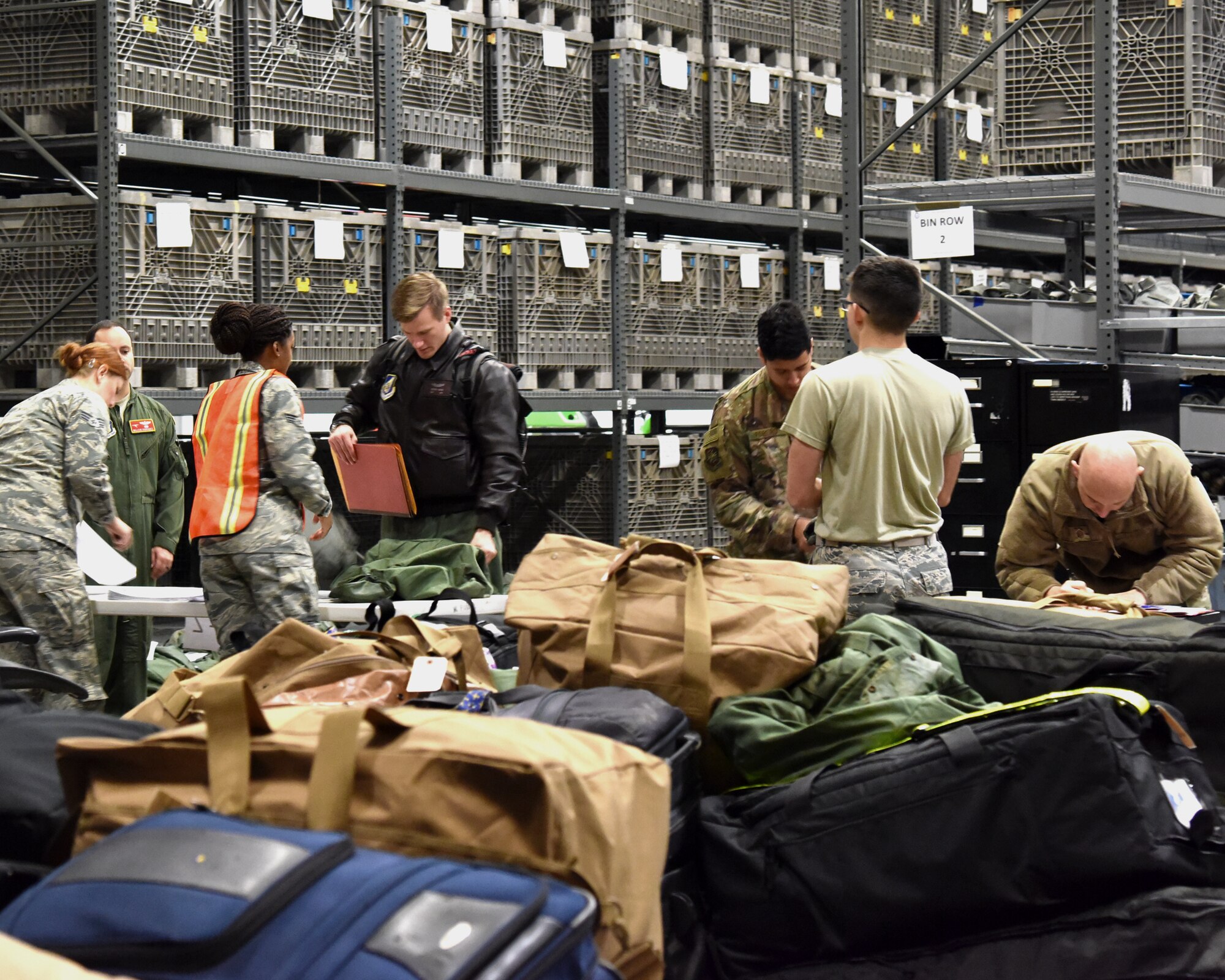 913th Airlift Group Airmen are issued personal protective equipment while processing through the pre-deployment function line Jan. 3, 2019, at Little Rock Air Force Base, Ark.