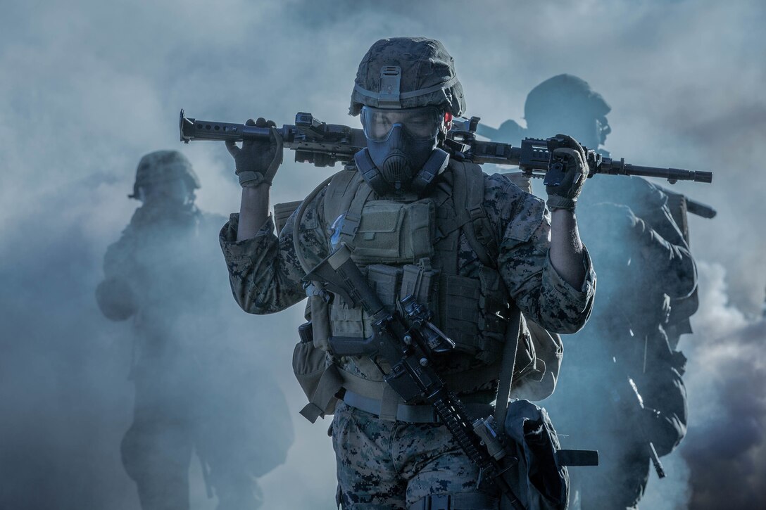 U.S. Marines with 1st Battalion, 1st Marine Regiment, 1st Marine Division, hike through a simulated chemical attack at Marine Corps Base Camp Pendleton, California, Jan. 12, 2019.