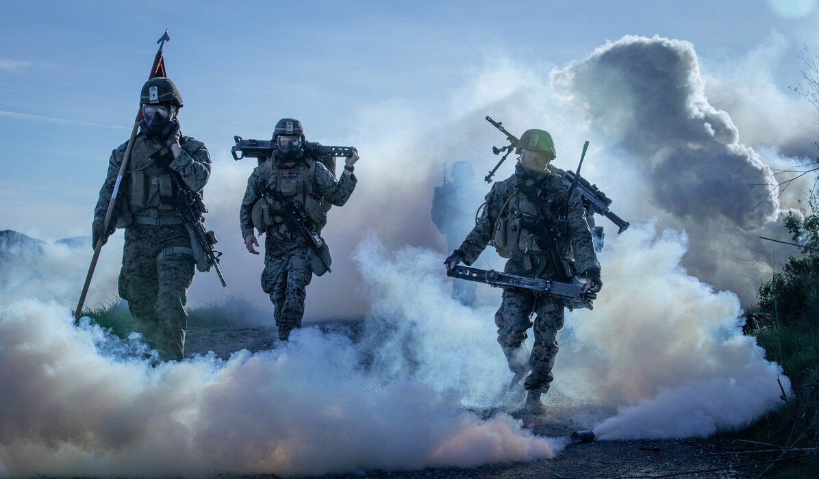 U.S. Marines from 1st Battalion, 1st Marine Regiment, 1st Marine Division hike through a simulated chemical attack at Marine Corps Base, Camp Pendleton, California, Jan. 12, 2019.