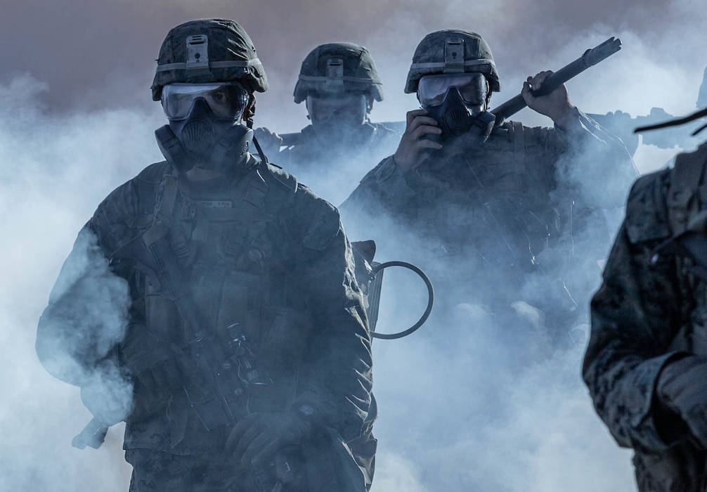 U.S. Marines with 1st Battalion, 1st Marine Regiment, 1st Marine Division, hike through a simulated chemical attack at Marine Corps Base Camp Pendleton, California, Jan. 12, 2019.