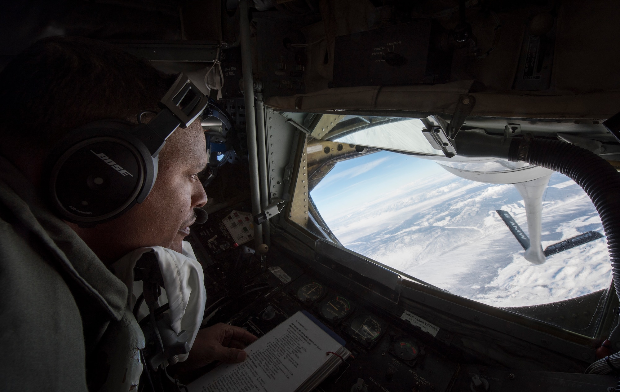 U.S. Air Force Tech. Sgt. Norman Germer, a 91st Air Refueling Squadron KC-135 Stratotanker boom operator, MacDill Air Force Base, Fla., prepares to refuel U.S. Air Force fighter aircraft during exercise Red Flag 19-1 at Nellis AFB, Nev., Feb. 7, 2019. Germer was part of two aircrews from MacDill AFB providing aerial refueling during the combat training exercise that prepares the U.S. and its allies to fight and win together against adversaries. (U.S. Air Force photo by Senior Airman Ashley Perdue)