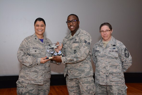Col. Dana Nelson, 507th Air Refueling Wing Vice Commander, and Chief Master Sgt. Julie Hudson, 507th Mission Support Group superintendent, present the Airman of the 4th Quarter 2018 Award to Senior Airman Shannon Glover, 507th Security Forces Squadron, Feb. 10, 2019, at Tinker Air Force Base, Oklahoma. (U.S. Air Force photo by Tech. Sgt. Samantha Mathison)