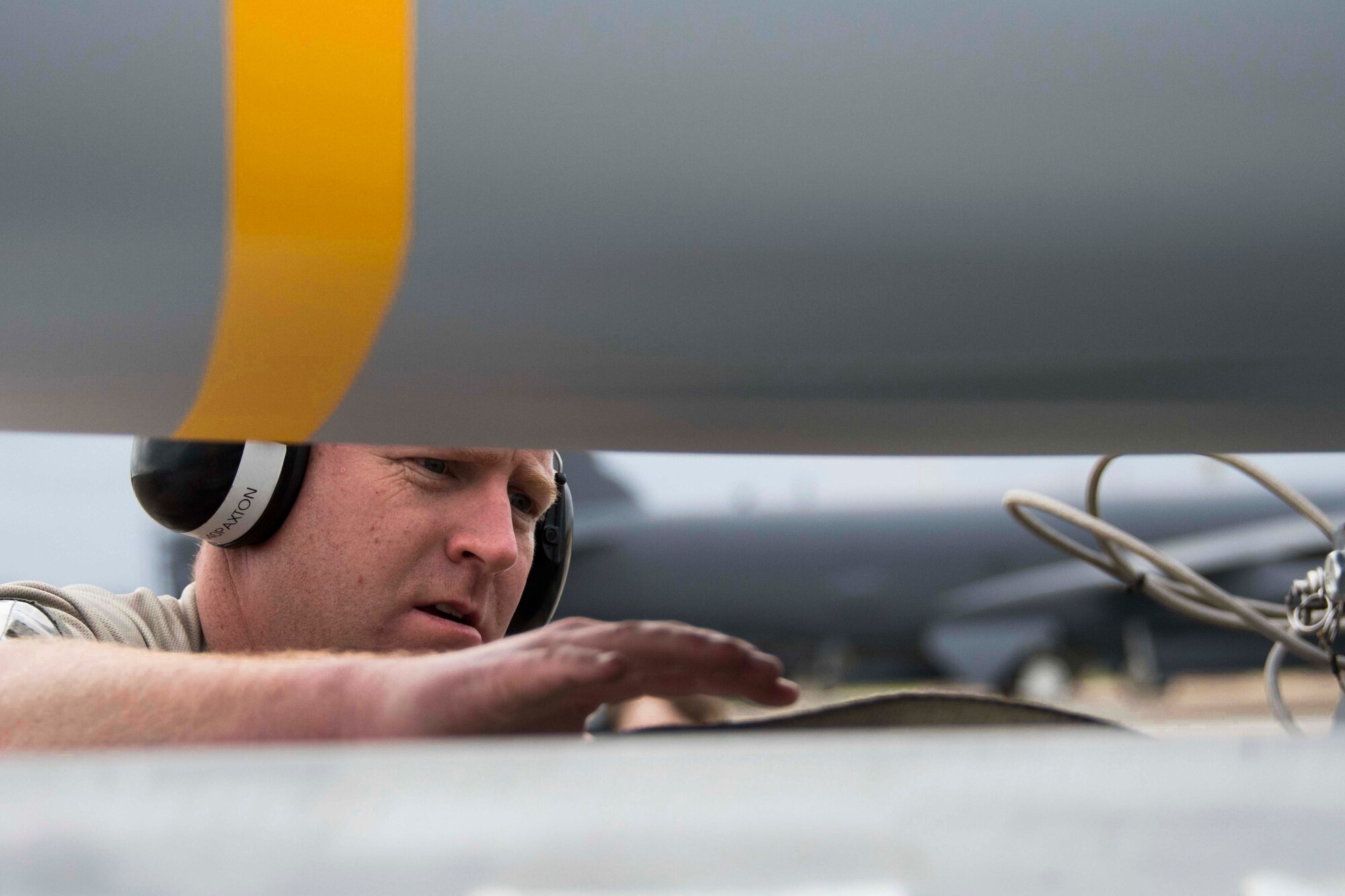 U.S. Air Senior Master Sgt. John Paxton, 307th Aircraft Maintenance Squadron aircraft armament systems superintendent, inspect an AGM-158 Joint Air-to-Surface Standoff Missile prior to loading on a Conventional Rotary Launcher at Barksdale Air Force Base, Louisiana, Feb. 6, 2019.  The JASSM’s were part of a test conducted by Reserve Citizen Airmen and active duty to see if upgrades to the CRL would allow it to power eight of the munitions simultaneously.  (U.S. Air Force photo by Master Sgt. Ted Daigle)