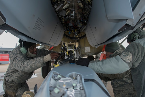 Aircraft armament systems specialists assigned to the 307th Aircraft Maintenance Squadron unload an AGM-158 Joint Air-to-Surface Standoff Missile from a Conventional Rotary Launcher at Barksdale Air Force Base, Louisiana, February 9, 2019. The munitions were placed on the CRL by Reserve Citizen Airmen during a test to see if the weapons platform could power on eight JASSM’s at one time.  (U.S. Air Force photo by Airman 1st Class Maxwell Daigle)
