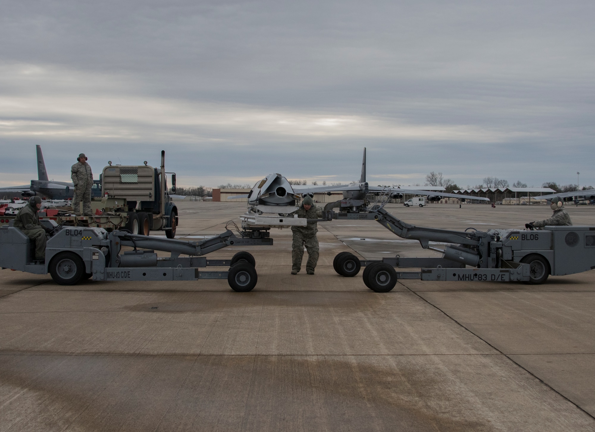 Aircraft armament systems specialists assigned to the 307th Aircraft Maintenance Squadron prepares to load an AGM-158 Joint Air-to-Surface Standoff Missile onto a trailer at Barksdale Air Force Base, Louisiana, February 9, 2019. The JASSM’s were part of a test of the Conventional Rotary Launcher, a weapons platform on the B-52 Stratofortress.  The test was designed to see if the CRL could provide power to eight JASSM’s at once.  (U.S. Air Force photo by Airman 1st Class Maxwell Daigle)