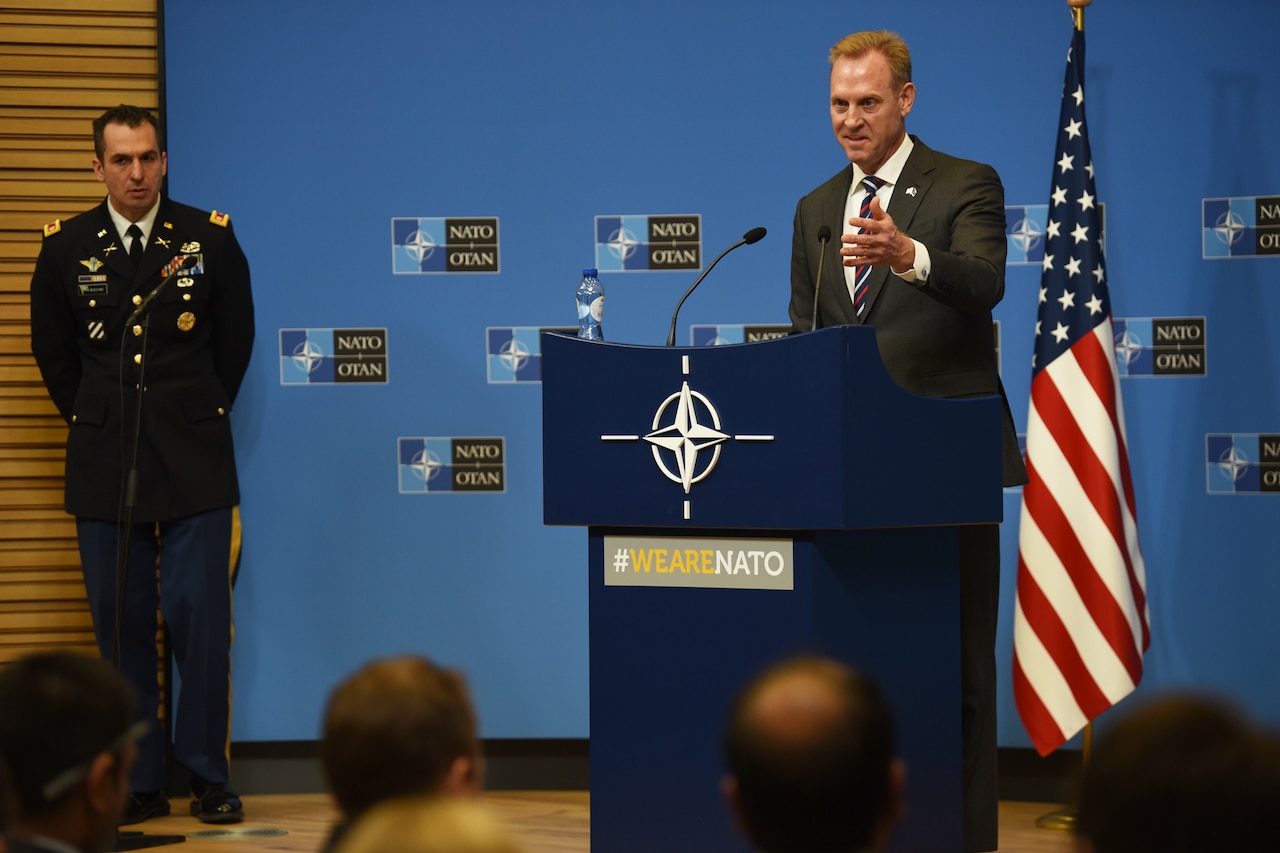 Acting Defense Secretary Patrick M. Shanahan speaks from behind a lectern.