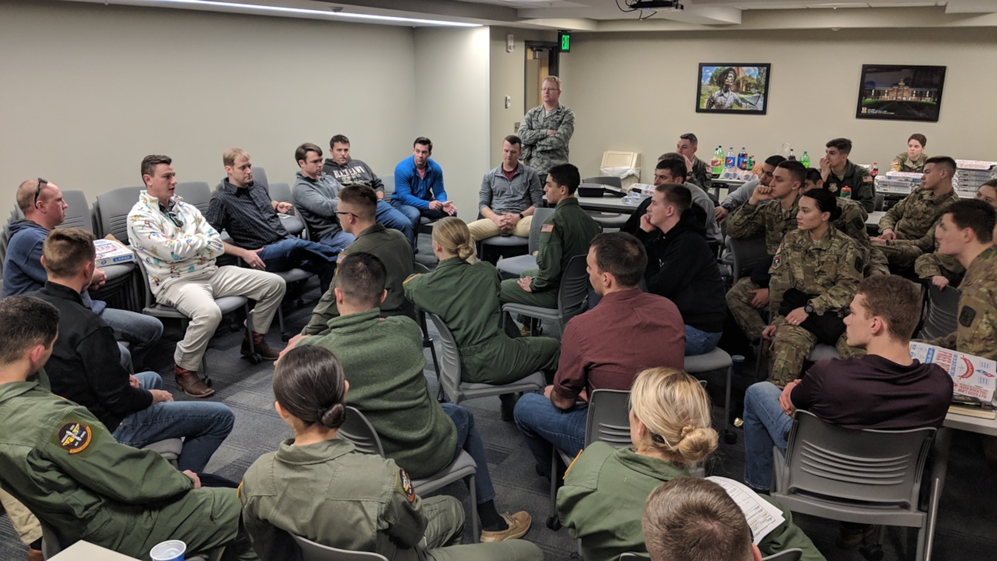 Virginia Tech Air Force ROTC Detachment 875 cadets chat with instructor pilots from the 37th and 48th Flying Training Squadrons from Columbus Air Force Base, Mississippi, Feb. 8, 2019, in Blacksburg, Virginia. The IPs hosted a social in the dorms, where cadets could ask questions about pilot life and their experiences. (Courtesy photo)