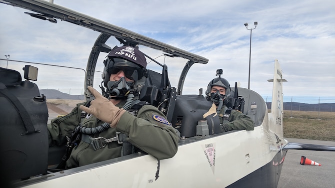 Capt. Andrew Barstow, 37th Flying Training Squadron assistant chief of training, and Cesar Ibarra Jr., Virginia Tech Air Force ROTC Detachment 875 cadet, pose for a photo before a sortie in a T-6 Texan II, at Roanoke Blacksburg Regional Woodrum Field, Virginia. In addition to working with instructor pilots, cadets were exposed to static displays, major weapons system briefs, and Q-and-A sessions with a team of aircrew flight equipment personnel and the 14th Medical Group flight surgeon from Columbus Air Force Base, Mississippi. (Courtesy photo)