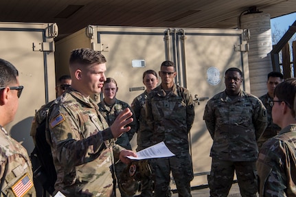 Army Capt. Corey Gunderson, 50th Expeditionary Signal Battalion Delta Company commander, gives a briefing Feb. 7, 2019 at Joint Base Charleston, S.C.