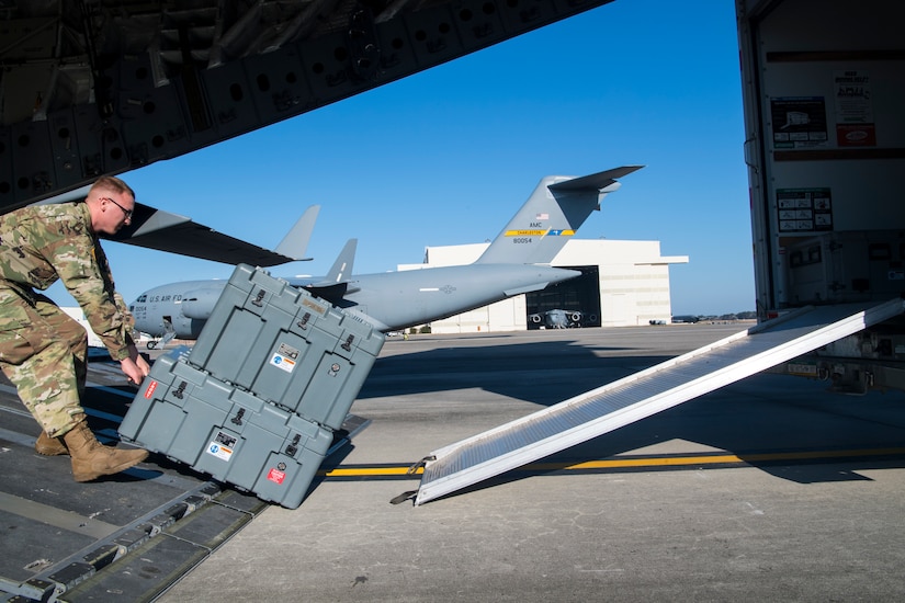 Army Sgt. William Suehn, 50th Expeditionary Signal Battalion key leader enroute node team chief, pulls communications equipment onto a C-17 Globemaster III Feb. 7, 2019, at Joint Base Charleston, S.C.