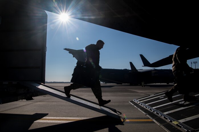 Army Sgt. William Suehn, 50th Expeditionary Signal Battalion key leader enroute node team chief, pulls communications equipment onto a C-17 Globemaster III Feb. 7, 2019, at Joint Base Charleston, S.C. Suehn and fellow Soldiers trained at JBC to become certified in t