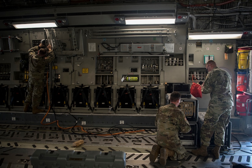 Soldiers from the 50th Expeditionary Signal Battalion set up communications systems in a C-17 Globemaster III Feb. 7, 2019, at Joint Base Charleston, S.C.
