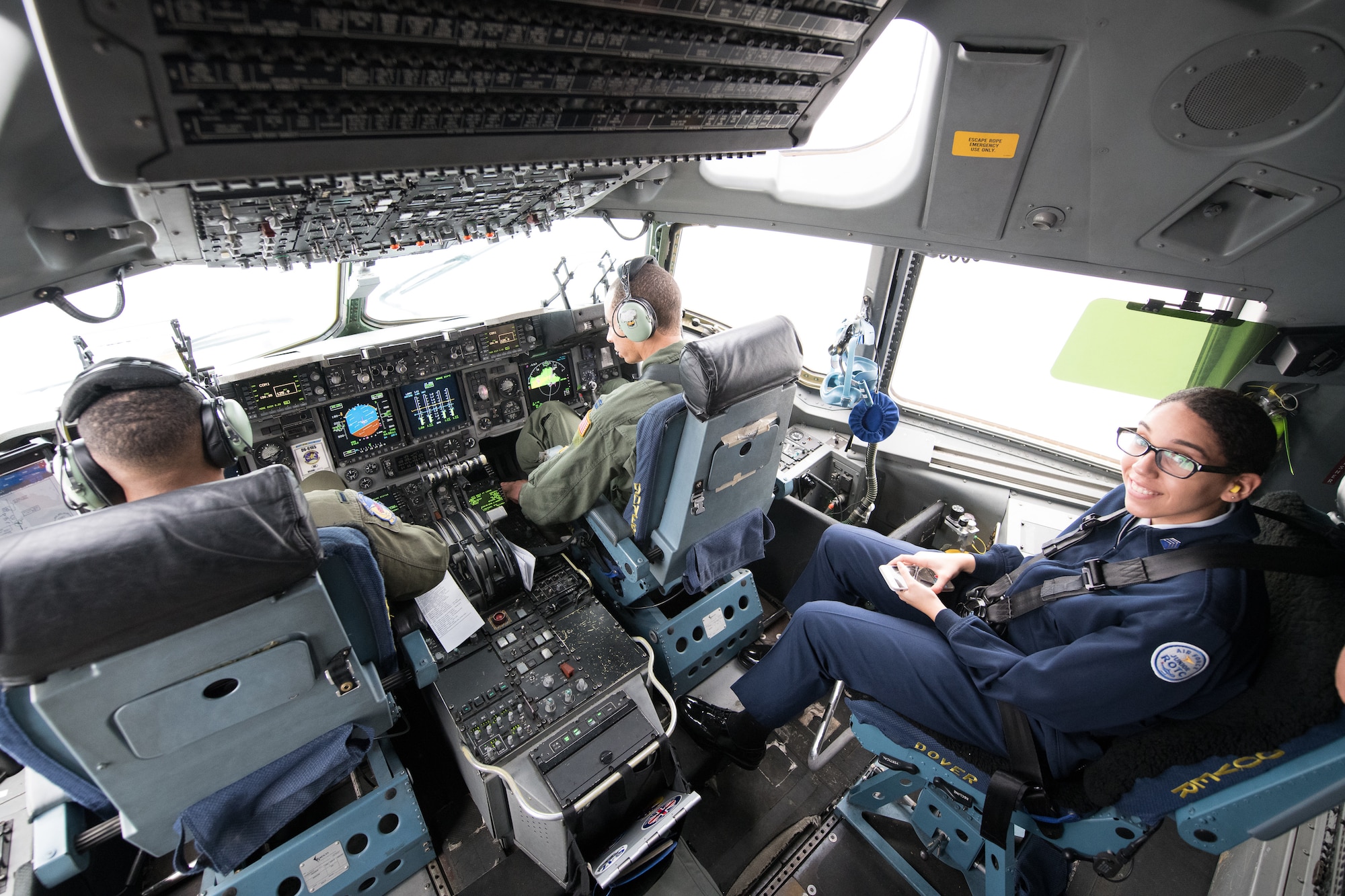 Sarah Smith, Dover High School JROTC Cadet, sits in the cockpit of a C-17 Globemaster III during the African-American Heritage Flight Feb. 12, 2019, at Dover Air Force Base, Delaware. The cadets had the opportunity to observe takeoff and landing operations from the cockpit. (U.S. Air Force photo by Mauricio Campino)