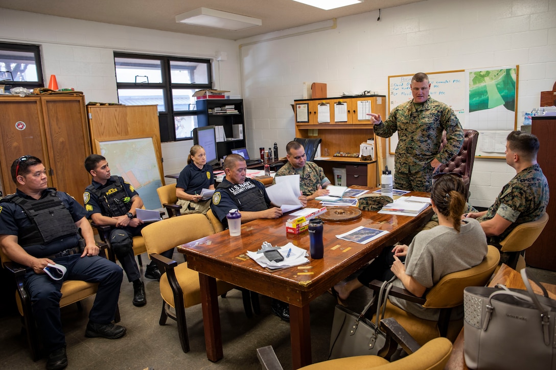 U.S. Marine Corps Chief Warrant Officer 2 Jeffrey Wright, the officer in charge of Pu’uloa Range Training Facility, speaks to representatives with local law enforcement and installation security during a meeting, Pu’uloa Range Training Facility, Feb. 13, 2019.