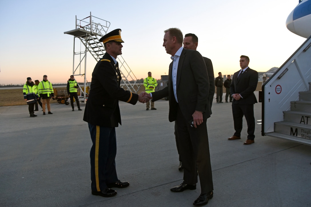 Acting Defense Secretary Patrick M. Shanahan exchanges greetings with a military leader.