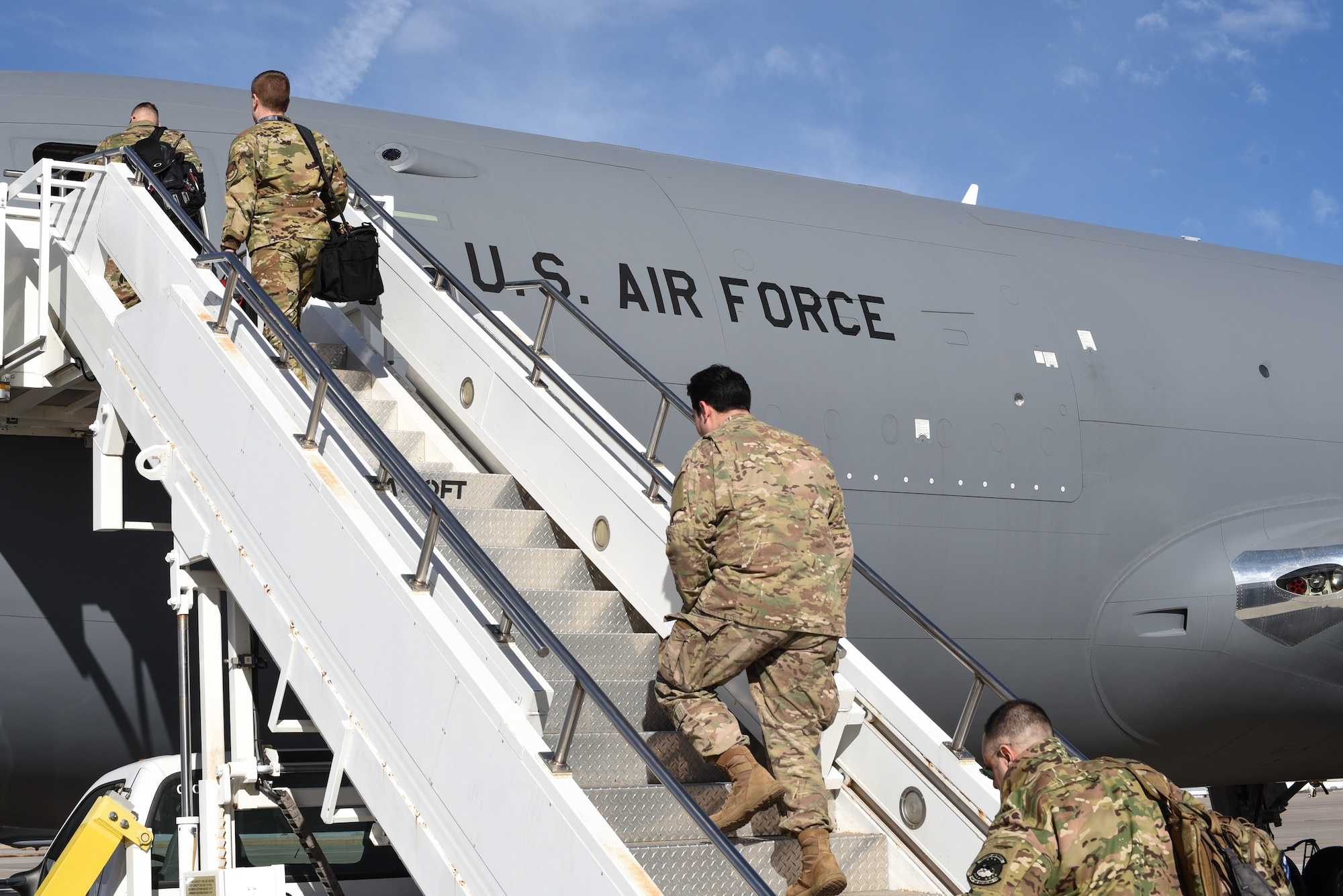 A KC-46A Pegasus aircrew assigned to the 344th Air Refueling Squadron boards a KC-46 to preform familiarization training Feb. 14, 2019, at McConnell Air Force Base, Kan. Familiarization training is comprised of four phases to help Team McConnell work out any potential kinks before being fully operational. (U.S. Air Force photo by Airman 1st Class Alexi Myrick)