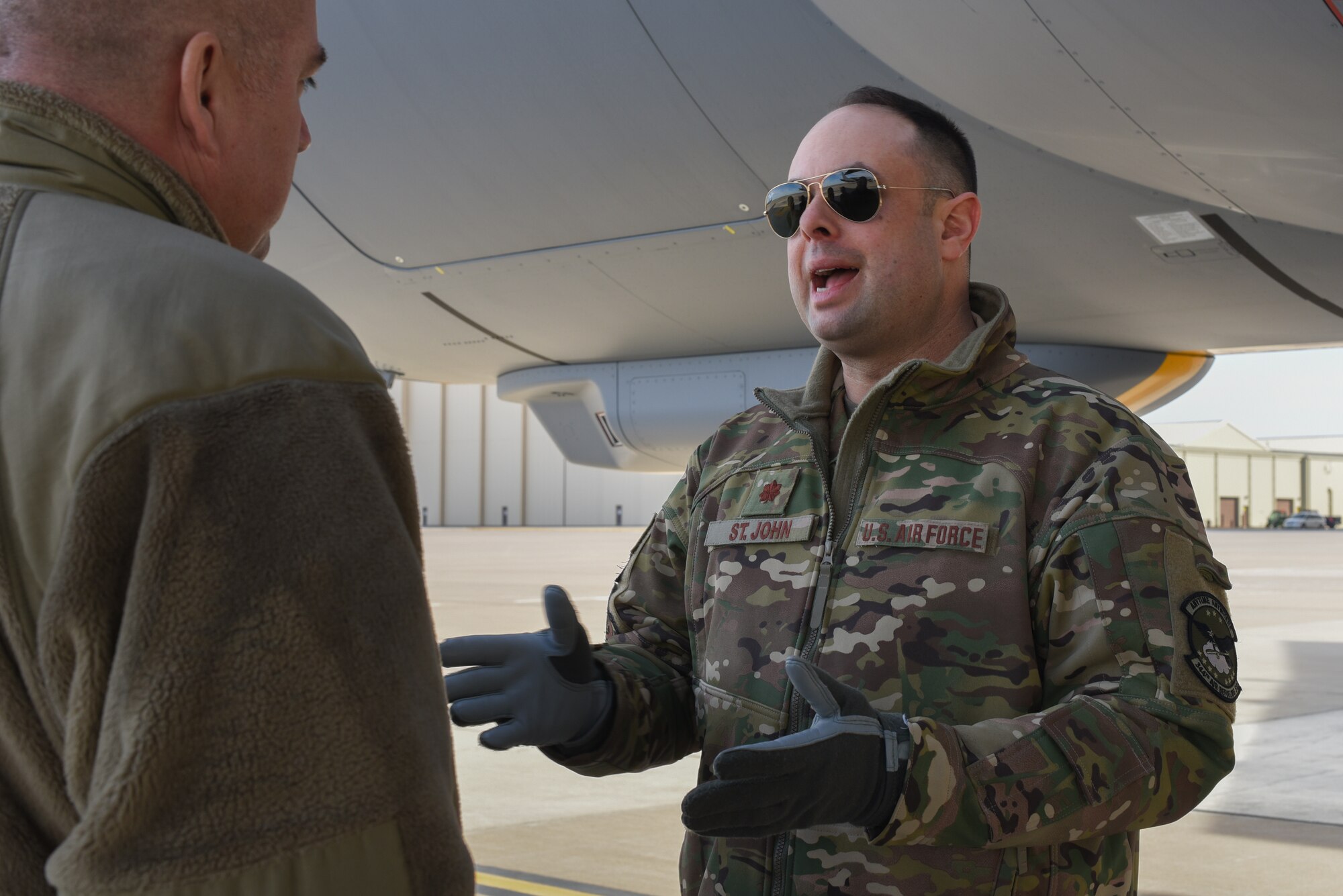 Maj. Derek St. John, 22nd Operations Group deputy chief of standards and evaluations, preforms pre-flight checks Feb. 14, 2019, at McConnell Air Force Base, Kan. The KC-46 has multiple refueling capabilities and can provide aerial refueling support multiple rotary and fix wing aircraft. (U.S. Air Force photo by Airman 1st Class Alexi Myrick)