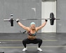 Capt. Rachel Schreiber doing on overhead squat during the U.S. Army Warrior Fitness Team Tryouts