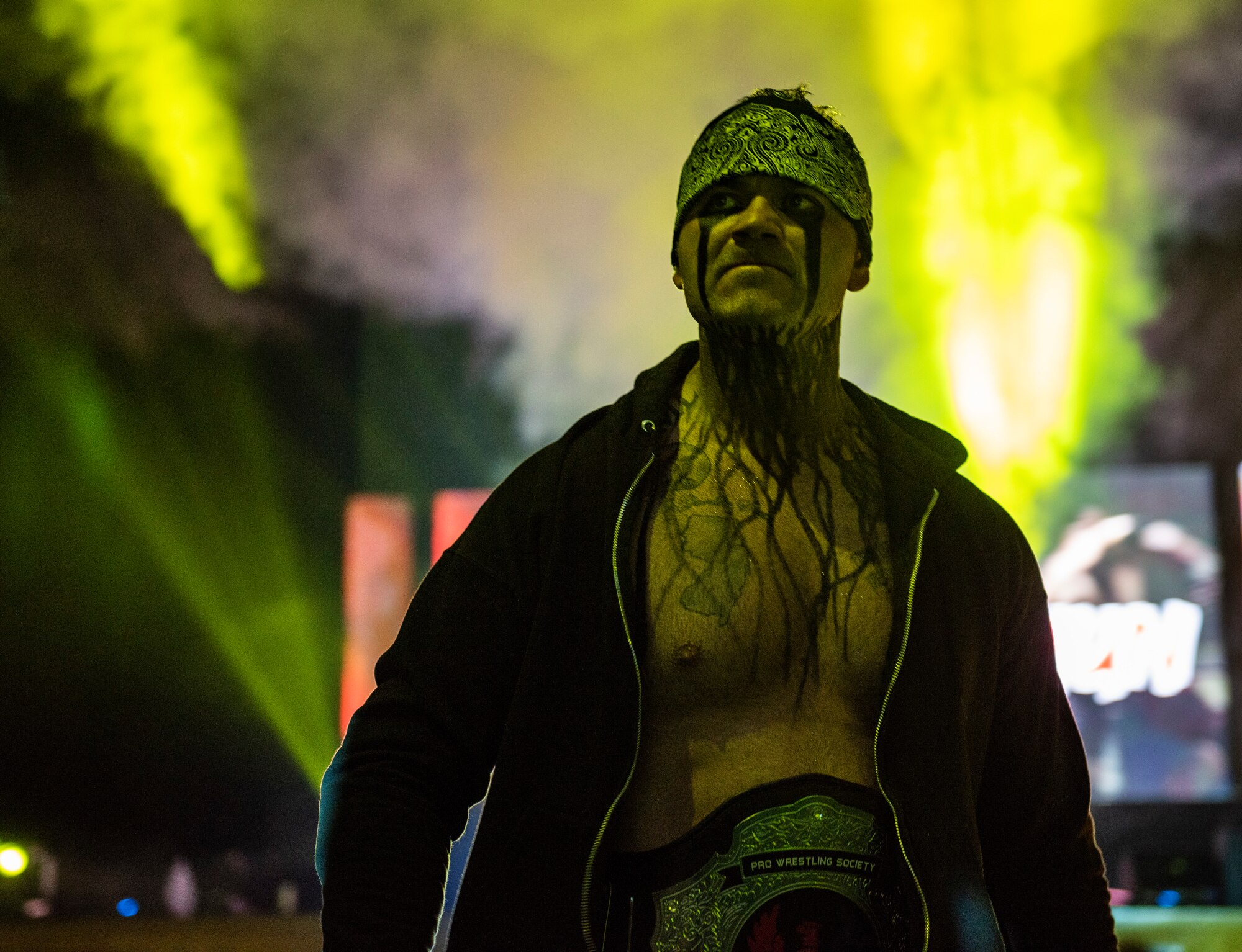 U.S. Air Force Tech. Sgt. Gregory Gauntt, 8th Logistics Readiness Squadron non-commissioned officer in charge of fuels knowledge operations, walks out to a wrestling ring in Pyeongtaek, Republic of Korea, Feb. 9, 2019. Gauntt’s wrestling persona is known as Ryan Oshun, and he has been wrestling with that name for more than seven years. (U.S. Air Force photo by Senior Airman Stefan Alvarez)