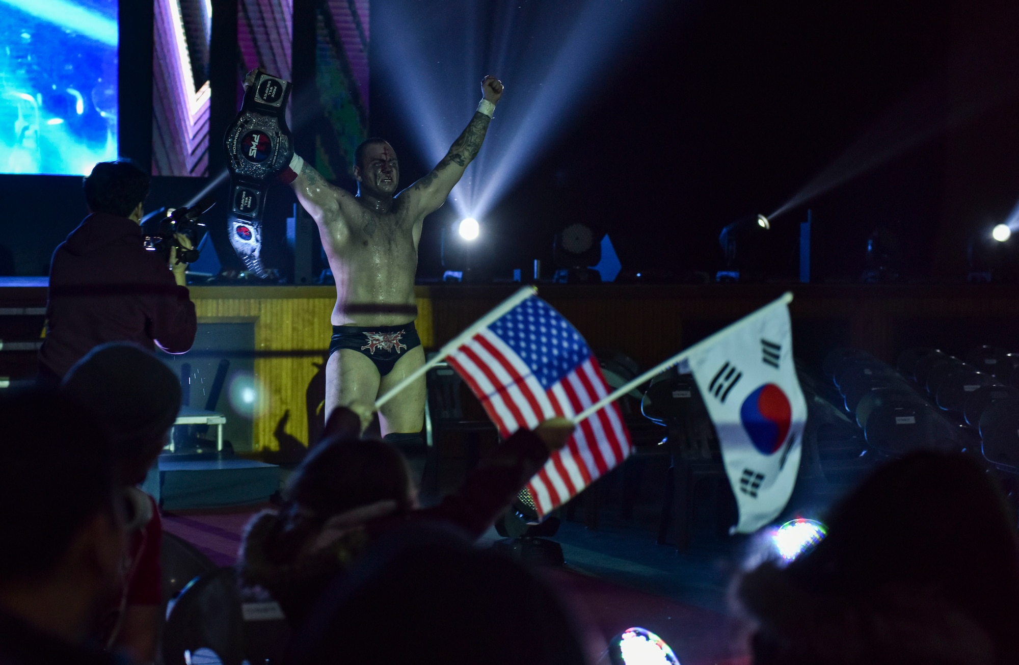 U.S. Air Force Tech. Sgt. Gregory Gauntt, 8th Logistics Readiness Squadron non-commissioned officer in charge of fuels knowledge operations, celebrates after winning a wrestling match in Pyeongtaek, Republic of Korea, Feb. 9, 2019. Gauntt goes by the name Ryan Oshun for professional wrestling and is currently one of two heavyweight champions on the Korean Peninsula. (U.S. Air Force photo by Senior Airman Stefan Alvarez)