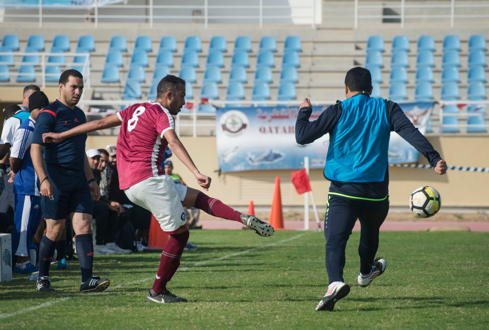 Members of the Qatar Emiri Air Force play soccer during Qatari National Sports Day Feb. 12, 2019, at Al Udeid Air Base, Qatar. U.S. and Qatar military forces were able to compete in team events including basketball, volleyball and soccer, as well as individual events such as swimming and ping pong throughout the morning. Qatari National Sports Day provided servicemembers from both nations an opportunity to strengthen military relations through friendly competition. (U.S. Air Force photo by Tech. Sgt. Christopher Hubenthal)