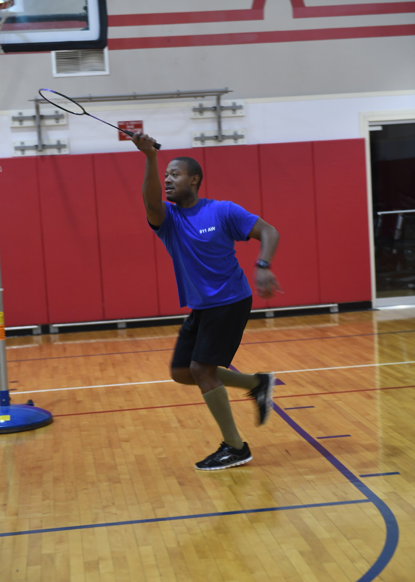 Tech. Sgt. Michael Gouch, command post controller with the 911th Command Post, hits the birdie at the badminton tournament at the Pittsburgh International Airport Air Reserve Station, Pennsylvania, Feb. 14, 2019. After working out in the gym, Gouch decided to join in the badminton tournament, replacing another player as they left. (U.S. Air Force Photo by Senior Airman Grace Thomson)