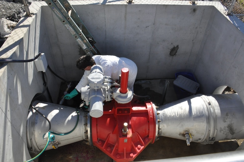 Rick McCann, LG2 Environmental Project Manager, adjusts valves to prepare for the release of dye into the Savannah Harbor Back River. The dye is being released as part of the testing process for the Dissolved Oxygen Injection System. The dye will help the Corps to track the path of the oxygen injected water once it is released from the plant