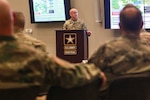 Col. Scott Gilman, the U.S. Army Central Training and Exercises division chief, briefs senior leaders from USARCENT, the U.S. Army Reserves and the U.S. Army National Guard during the Operation Spartan Shield Community of Excellence Forum at Patton Hall on Shaw Air Force Base, S.C., Feb. 6, 2019.