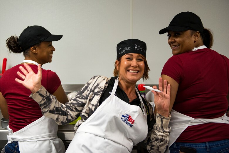 Contestants pose for a photo during the first Cupid Cake Wars, Feb. 13, 2019, at Moody Air Force Base, Ga. The event consisted of contestants working together in teams to create, bake and design their most inspired Valentine’s Day-themed cakes. (U.S. Air Force photo by Airman 1st Class Erick Requadt)