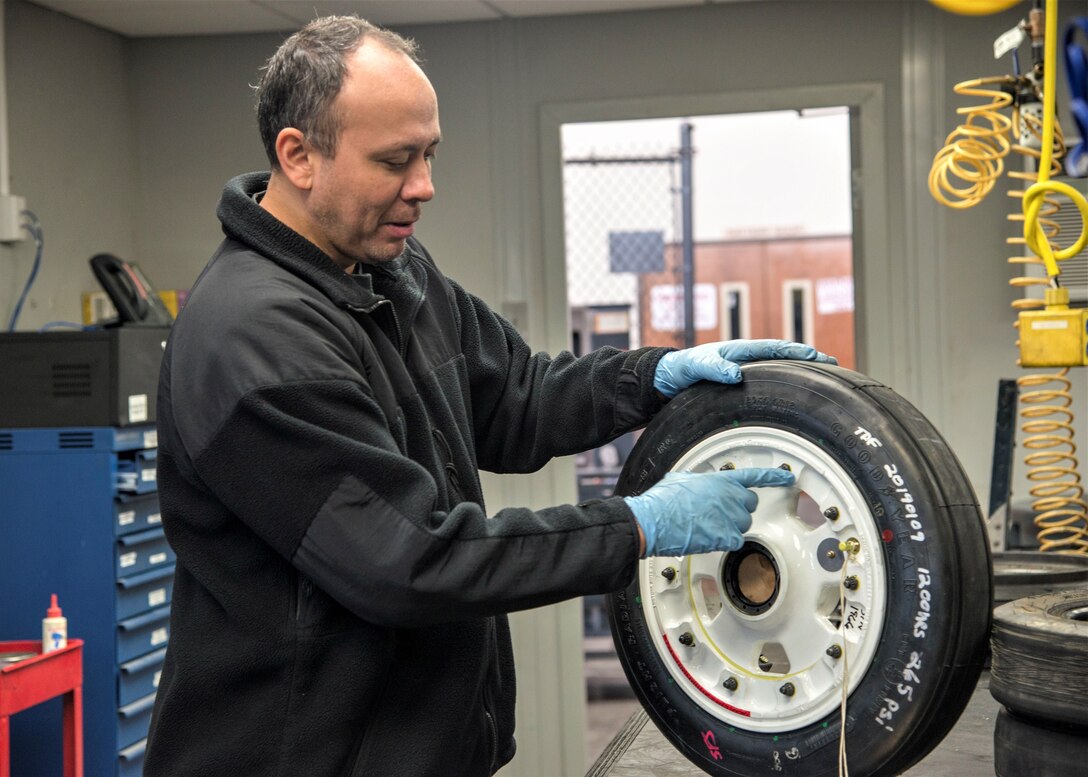 Glenn Nickelson, 12th Flying Training Wing aerospace ground equipment mechanic, conducts a final inspection on a wheel, checking each bolt by hand inside the 12th Maintenance Group Aircraft Wheel and Tire Shop on Feb. 14, 2019, at Joint Base San Antonio-Randolph, Texas. Tire shop technicians and AGE members are part of a team that ensure the integrity of the wheels and tires used on the 12th FTW’s fleet of trainer aircraft. (U.S. Air Force photo by Tech. Sgt. Ave I. Young)