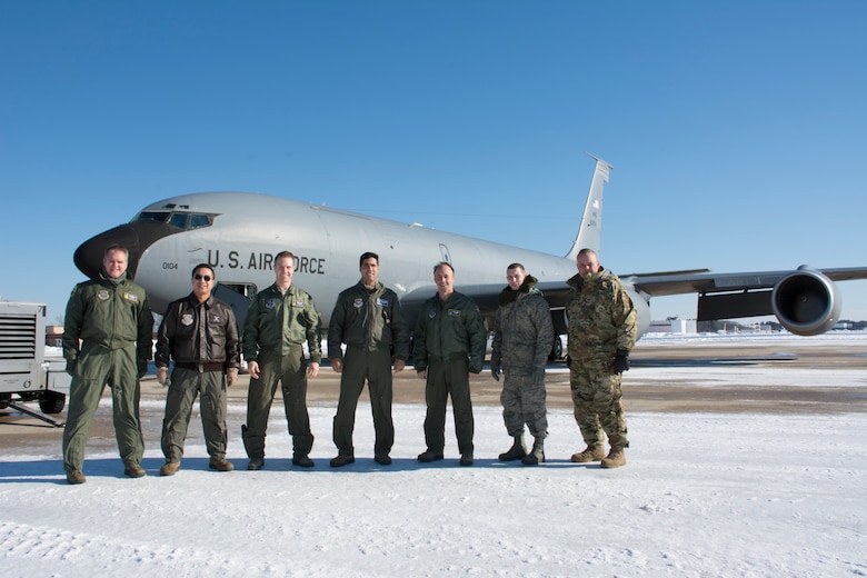 The Flight Crew of a KC-135R Stratotanker, tail number 58-0104, from the 157th Air Refueling Wing, New Hampshire Air National Guard, pose for a group photo prior to flying the aircraft to the 126th ARW, Scott  Air Force Base, Illinois, Jan. 30, 2019. From left, Tech. Sgt. Mark Brophy, Master Sgt. Somkit Chittakhone, Capt. Jorden Gauvin, Capt. Paul Anguita, Capt. Jefferey Mnich, Staff Sgt. Jared Karos, Master Sgt. John Bober, The aircraft is one of eight aircraft leaving the Wing during the unit’s divestiture of the KC-135. (U.S. Air National Guard photo by Tech. Sgt. Aaron P. Vezeau)